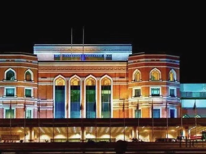 Allama Iqbal International Airport terminal building lit at night