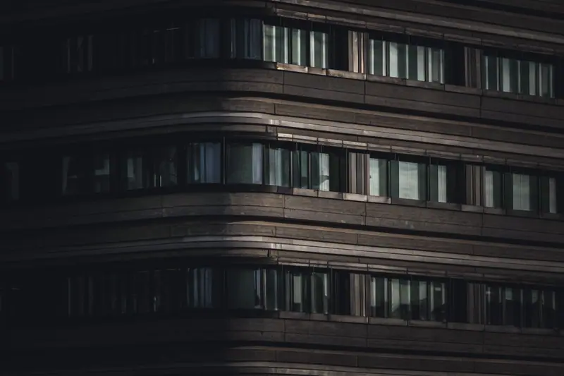 Modern building facade lit at night